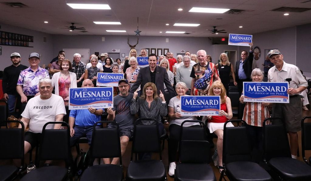 A group of supporters holding J.D. Mesnard campaign signs